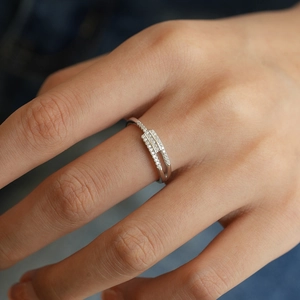 Detail of S925 sterling silver asymmetrical double row ring with sparkling moissanite stones