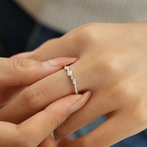 Asymmetric S925 sterling silver ring featuring sparkling moissanite stones on hand