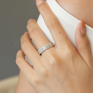 Elegant S925 sterling silver triple-row moissanite ring worn by a model on her finger
