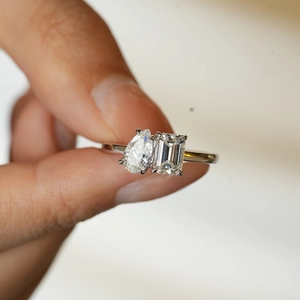 Toi et Moi ring with pear and emerald cut moissanite stones in 925 sterling silver