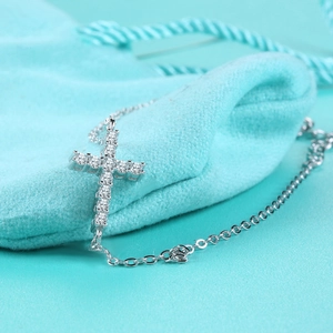 Elegant S925 sterling silver cross bracelet with sparkling moissanite and luxury jewelry bag