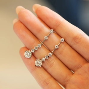 925 sterling silver moissanite stud earrings featuring a graduated round-cut stone design