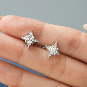 Pair of S925 sterling silver snowflake star earrings with moissanite center stones