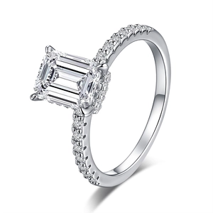 S925 sterling silver emerald cut ring with pavé moissanite accents on white background