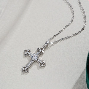 925 silver moissanite cross necklace with large center stone and heart-shaped hollow details