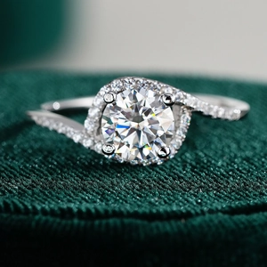 S925 sterling silver moissanite halo ring with bypass pavé band on green velvet