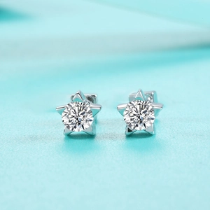 Macro detail of S925 sterling silver star stud earrings with brilliant moissanite center