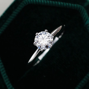 S925 sterling silver moissanite ring with classic six-prong crown setting in a green box