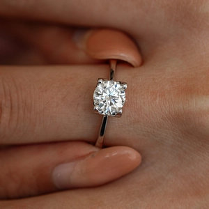Classic 925 sterling silver moissanite ring with a four-prong round cut stone