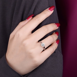 S925 sterling silver four-prong solitaire engagement ring worn on a finger