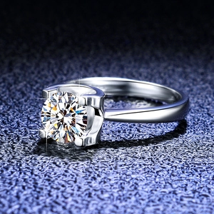 Macro view of s925 silver moissanite ring showing 4-prong setting and modern side detail