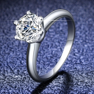 Macro shot of a classic six-prong moissanite ring with a brilliant round cut gemstone