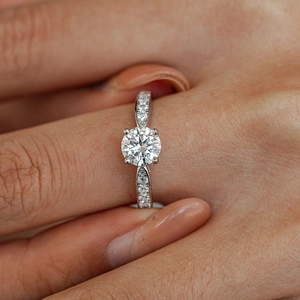 Classic S925 sterling silver four-prong moissanite ring with side-stone micro-paving on band