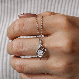 Classic 925 sterling silver heart necklace with 0.5ct moissanite held in hand