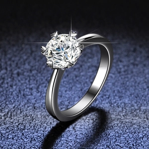 Classic six-prong snowflake moissanite ring in 925 sterling silver on starry background