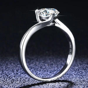 Macro view of 1.00ct moissanite center stone on a polished Pt950 platinum ring setting