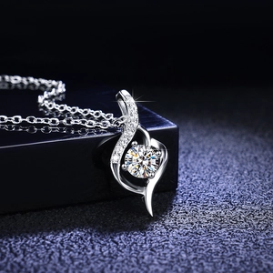 Macro view of S925 sterling silver swirl pendant with a 0.5ct moissanite center stone