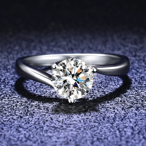 Macro shot of s925 silver ring with a round moissanite in a modern twisted setting