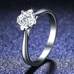 Macro shot of 925 sterling silver ring featuring a six-prong round brilliant cut diamond