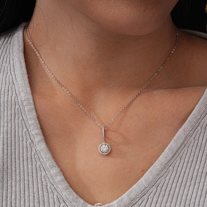 Classic S925 sterling silver halo moissanite necklace on a model for women