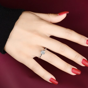 Macro detail of high-grade 925 sterling silver four-prong ring with sparkling solitaire moissanite