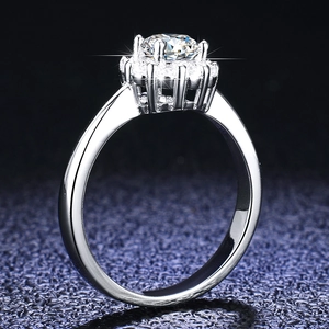 Macro view of 925 sterling silver halo ring with a round cut sparkling moissanite stone