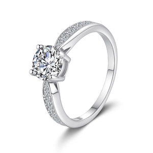 S925 sterling silver four-prong moissanite ring with side accent diamonds on white background