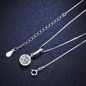 Detail of s925 silver necklace featuring round cut moissanite with snowflake halo setting