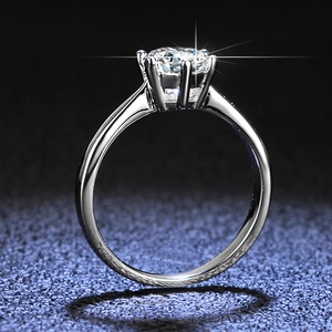 Macro side view of a classic six-prong solitaire ring with a brilliant round-cut stone