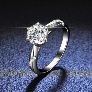 Macro shot of a classic six-prong S925 silver moissanite ring with side stones
