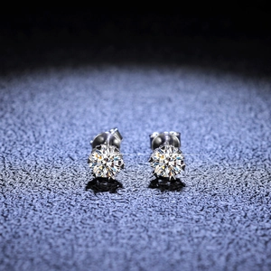 Macro view of S925 sterling silver snowflake stud earrings with classic six-prong setting