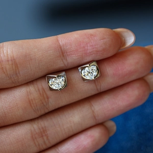 S925 sterling silver moissanite stud earrings with bezel set heart shaped design