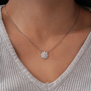 Classic 925 sterling silver sun flower necklace with moissanite pendant on a model