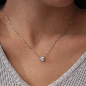 Classic S925 sterling silver necklace with a 1-carat moissanite snowflake pendant on model