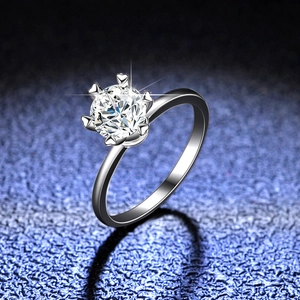 Elegant 925 sterling silver moissanite ring with six-claw heart setting on dark background