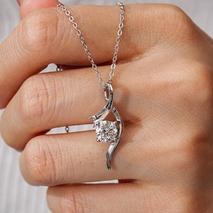 Elegant S925 sterling silver necklace featuring 1 carat round moissanite solitaire pendant