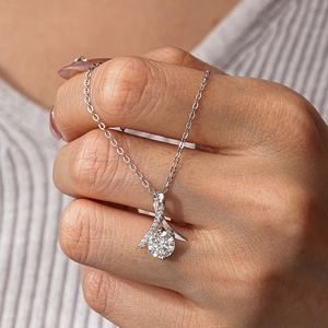 Classic S925 silver moissanite pendant necklace shown on a grey ribbed sweater