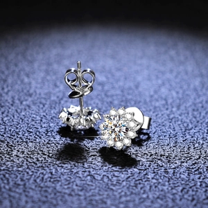 Macro detail of S925 silver sunflower stud earrings featuring moissanite center stones