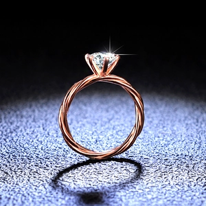 Elegant rose gold moissanite twisted band ring with a round six-prong brilliant diamond