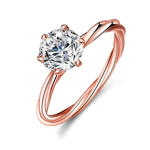 Moissanite ring in rose gold finish with vine twisted silver band and six-prong setting