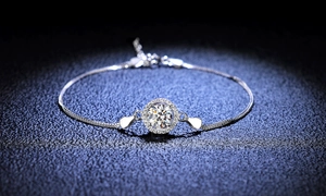 925 silver halo bracelet with a round moissanite center stone on dark background