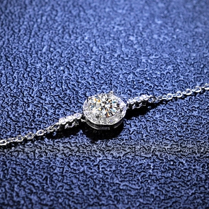 Minimalist 925 sterling silver moissanite bracelet with a brilliant round cut center stone