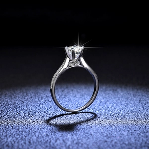 Classic moissanite diamond ring in sterling silver with four-prong setting and side accents