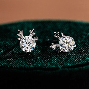 Elegant S925 silver moissanite elk antler stud earrings on dark green velvet box