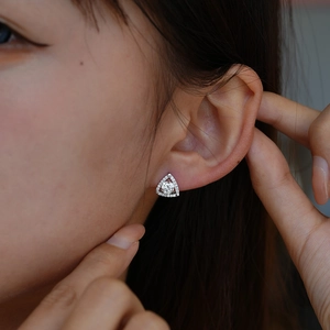 Sparkling geometric moissanite triangle stud earrings in S925 sterling silver on model
