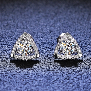 Macro shot of S925 sterling silver triangle halo moissanite stud earrings on blue texture