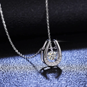 S925 sterling silver horseshoe necklace with dancing moissanite pendant on black background