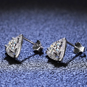 Macro shot of S925 silver triangle moissanite studs with micro-pave details
