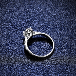 Moissanite ring in 925 silver with a classic six-prong setting and pavé side stones