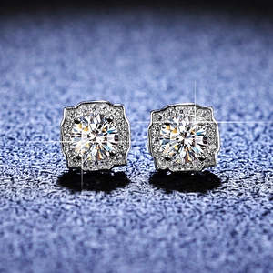 Macro shot of silver Moissanite stud earrings featuring a halo square pave design